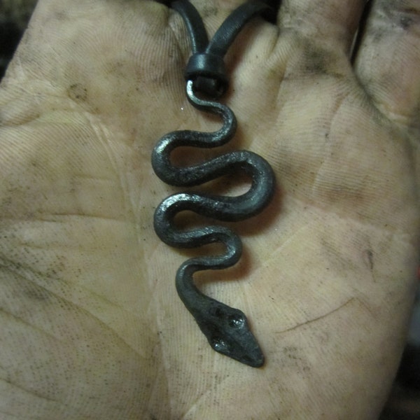 A hand forged serpent pendant. Comes supplied with a high quality elk leather thread.