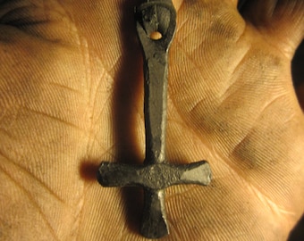 A hand forged inverted Cross pendant . Comes supplied with a high quality elk leather thread.