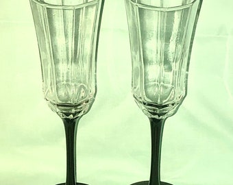 A Set of Two Arocroc Octime Black Stem Champagne Flutes, Champagne Toasting Flutes