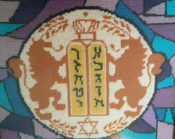 A Framed Stained Glass Like Needlepoint of Torah Shield With Two Lions of Judah Holding Ten Commandments Tablets 1975