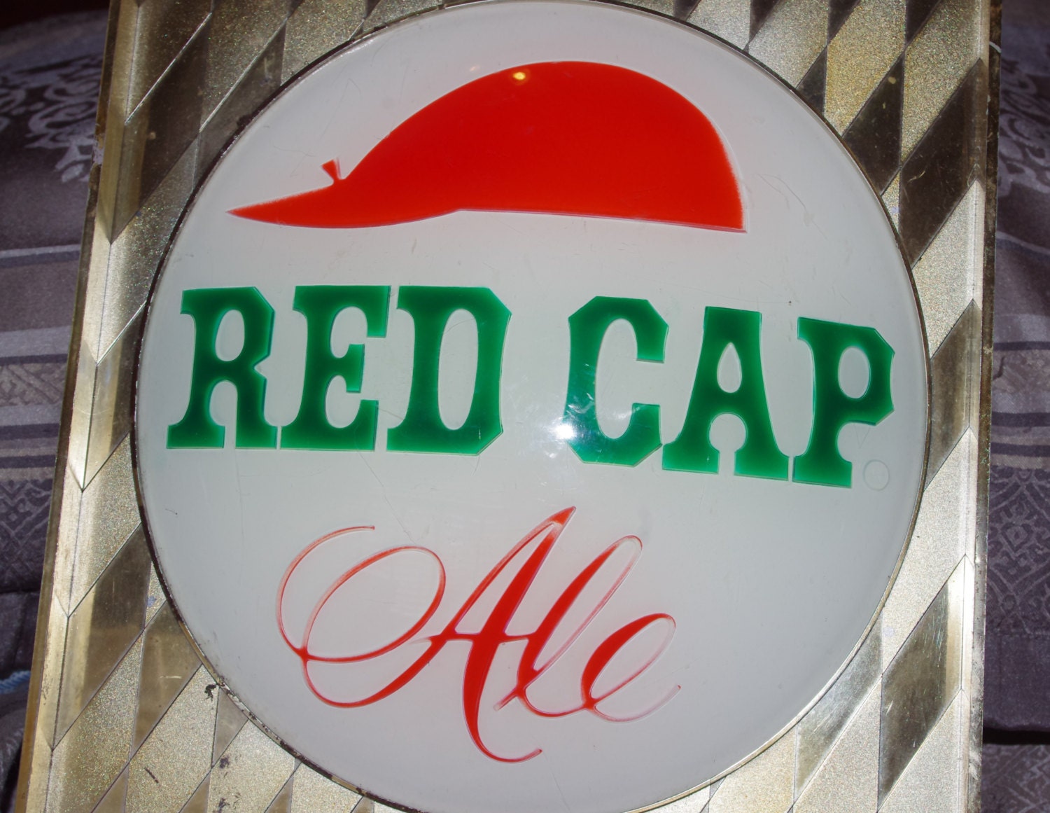 A 1950's Red Cap Sign Lamp