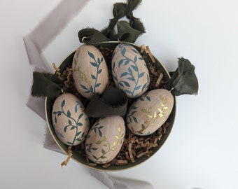 Green and gold wooden Easter eggs - botanical forest