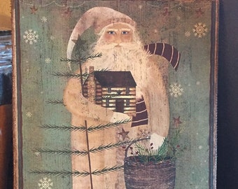 May include: A vintage-style Christmas illustration of Santa Claus holding a small log cabin and a basket of greenery. He is standing in front of a green pine tree with snowflakes falling around him. The text "Merry Christmas" is printed at the bottom of the image.
