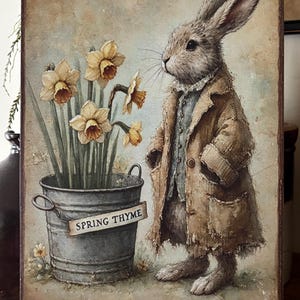 May include: A painting of a rabbit wearing a brown coat standing next to a bucket of daffodils. The bucket has a sign that says "Spring Thyme".