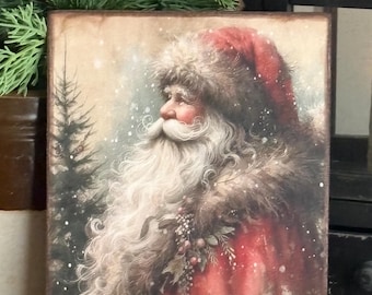 May include: A rectangular wooden sign with a vintage illustration of Father Christmas in a red coat and hat, with a long white beard. The artwork has a snowy background and a rustic, aged appearance, ideal for Christmas decorations.