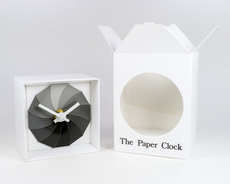 White Paper Clock modern design gift item with accurate quartz movement, and shades of gray colored face. image 3