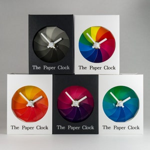 White Paper Clock modern design gift item with accurate quartz movement, and pink/purple colored face. image 4