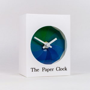 White Paper Clock modern design gift item with accurate quartz movement, and blue/green colored face. image 1