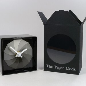 Black Paper Clock modern design gift item with accurate quartz movement, and shades of gray colored face. image 3