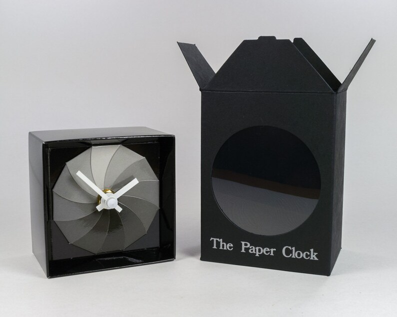 Black Paper Clock modern design gift item with accurate quartz movement, and shades of gray colored face. image 3