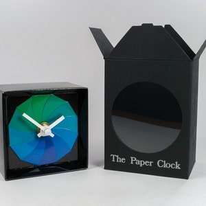 Black Paper Clock modern design gift item with accurate quartz movement, and blue/green colored face. image 3