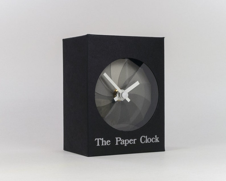 Black Paper Clock modern design gift item with accurate quartz movement, and shades of gray colored face. image 1