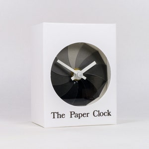 White Paper Clock modern design gift item with accurate quartz movement, and shades of gray colored face. image 1
