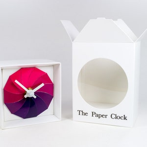 White Paper Clock modern design gift item with accurate quartz movement, and pink/purple colored face. image 3