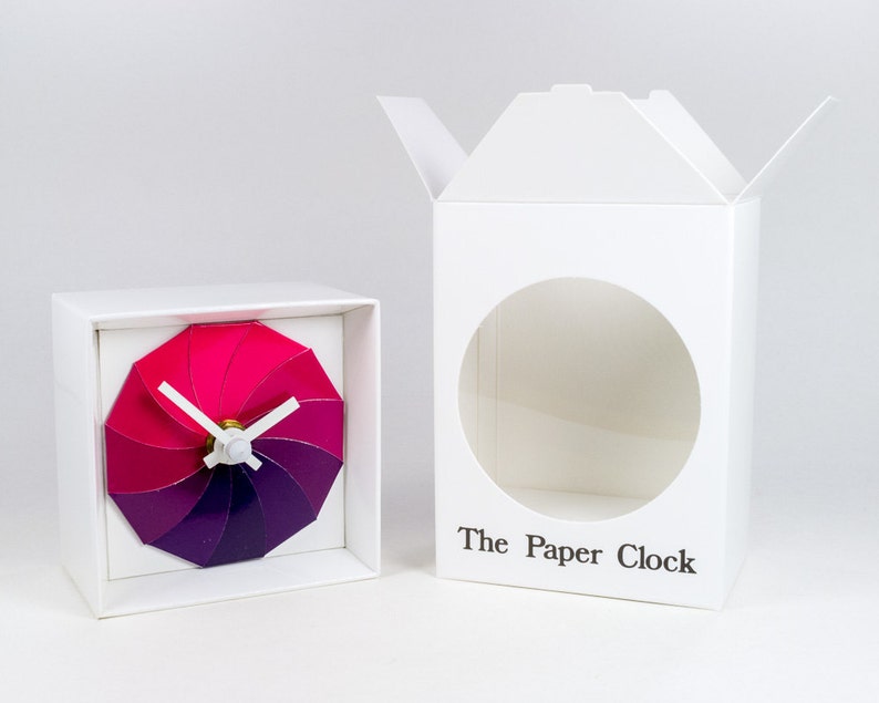 White Paper Clock modern design gift item with accurate quartz movement, and pink/purple colored face. image 3