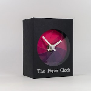 Orologio in carta nera, articolo da regalo dal design moderno con movimento al quarzo preciso e quadrante rosa/viola.