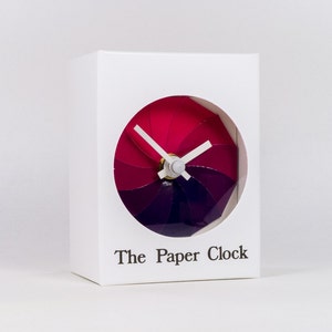 White Paper Clock modern design gift item with accurate quartz movement, and pink/purple colored face. image 1