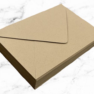 May include: A stack of brown kraft paper envelopes. The envelopes are blank and have a standard flap.