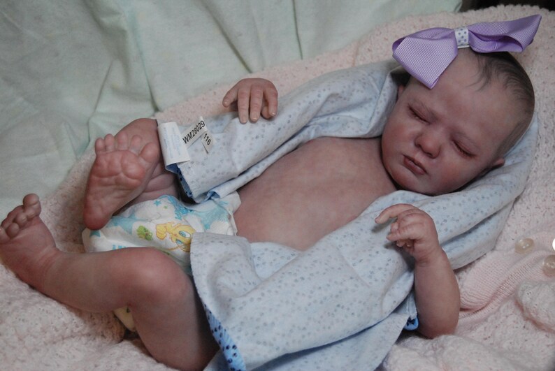 realborn logan sleeping