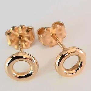 18K Gold Post Earrings. Solid 18K Gold Tiny Donut Style Studs With 18K Gold Ear Nuts.