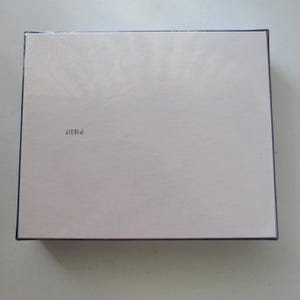 May include: A rectangular box with a light, off-white surface and a dark border. The text "P18317" is printed in black in the lower left corner. The box appears to be new and unused.