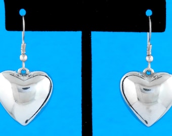 Vintage zilverkleurige gezwollen harthangeroorbellen