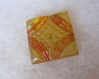 Chunky square Bakelite sewing button - clear apple juice color - carved