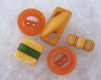 Lot of 5 vintage Bakelite sewing buttons - orange, cookie, pierced - fun ones