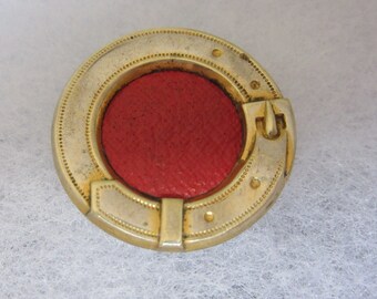 Medium vintage sewing button - red leather mounted in brass - belt buckle border - fancy and neat!