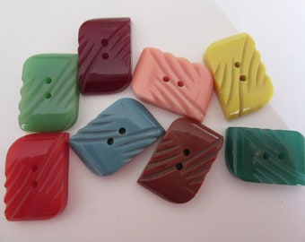 Large - vintage set of 8 casein sewing buttons - carved - neat shape - same but different colors - fun stuff!