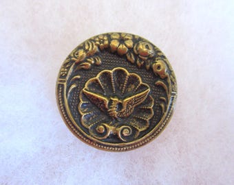 Medium antique sewing button - brass picture - bird on a shell - floral border