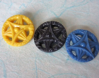 3 medium vintage sewing buttons - openwork - star design - blue, yellow, black - lovely!