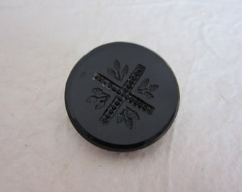 Medium antique black glass sewing button - Incised cross and flower design