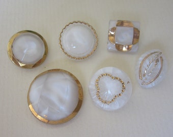 6 vintage glass sewing buttons - moonglows - white with gilding - one pictorial leaf - collector buttons