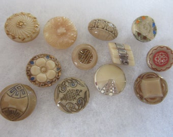 Lot of 12 small vintage sewing buttons - glass - caramel color with painted designs - pretty ones!