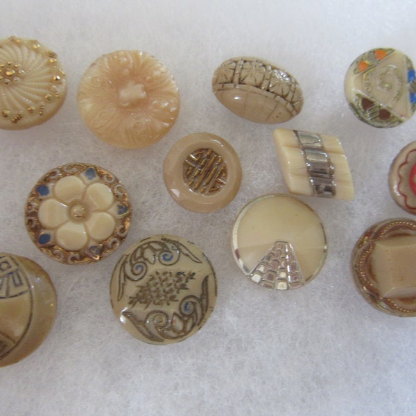 Lot of 12 small vintage sewing buttons - glass - caramel color with painted designs - pretty ones!