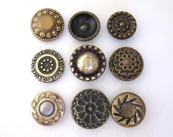 Lot of 9 small antique sewing buttons - brass - circular designs
