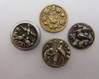 4 antique small brass sewing buttons - birds - one fable - one openwork - lovely collectibles
