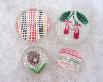 4 Lucite polymer sewing buttons - reverse carved and painted designs - Mid 20th century modern