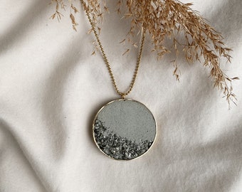 Concrete necklace | concrete jewelry | light gray concrete | crushed pyrite | statement necklace | brass pendant | stainless steel