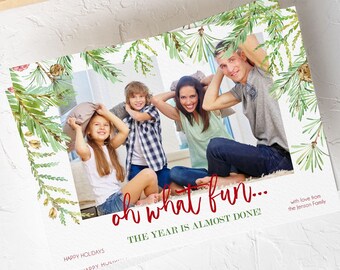 May include: A holiday greeting card featuring a family photo with a watercolor pine branch border. The red text reads "oh what fun... THE YEAR IS ALMOST DONE!" and "with love from the Jenson Family."