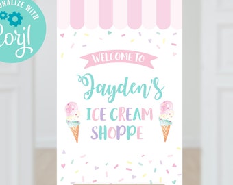 May include: A white sign with pink and blue accents, featuring a striped awning and ice cream cones. The sign reads "Welcome to Jayden's Ice Cream Shoppe".