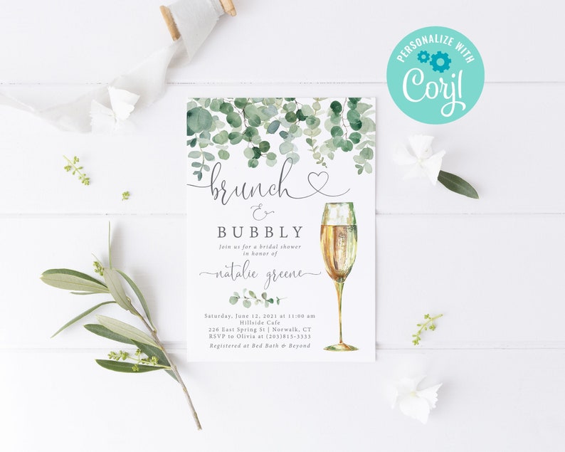 May include: A green and white bridal shower invitation with a watercolour illustration of eucalyptus leaves and a glass of champagne. The text reads "brunch & bubbly" and includes the bride's name, the date, time, location, and RSVP information.
