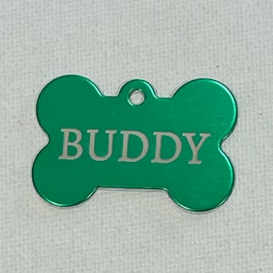 Dog/Cat Tags laser engraved with pets name and owner phone number on the back. image 1