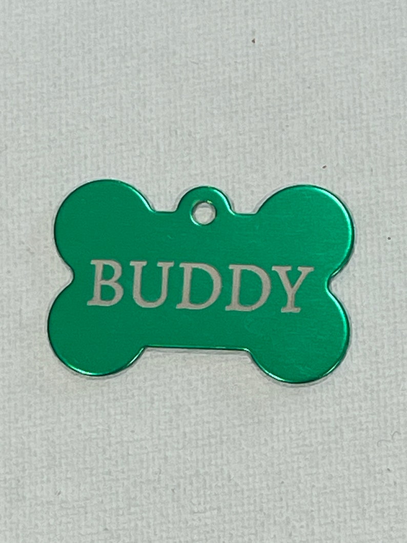 Dog/Cat Tags laser engraved with pets name and owner phone number on the back. image 1
