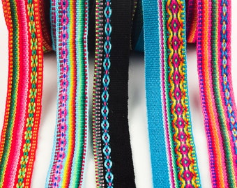 May include: Five colorful woven ribbon trims with geometric patterns. The ribbons are red, blue, black, turquoise, and rainbow.