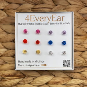 May include: A card displaying a variety of colorful hypoallergenic plastic stud earrings. The card reads "4EveryEar" and "Handmade in Michigan." The earrings are in shades of pink, red, blue, gold, and silver.