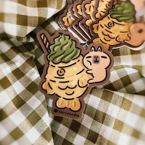 Moonch the Capybara with Taiyaki Ice Cream | Vinyl Sticker Moonch the Capybara with Taiyaki Ice Cream | Vinyl Sticker