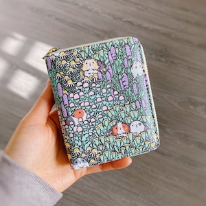 Carteira com zíper com padrão de porquinho da Índia e ervas de jardim