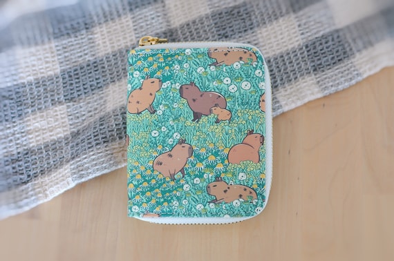Capybara Pattern Zipper Wallet featuring Noristudio Capybara Meadow Pattern